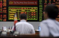 Traders work at the Philippine Stocks Exchange in Manila, March 2012. Asian markets came under pressure as a successful bond auction in Spain failed to raise spirits while weak US economic data also added to the general sense of pessimism