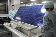 File picture shows workers assembling solar panels by hand at a factory in the eastern Chinese city of Wuxi. UN chief Ban Ki-moon made a call to double global consumption of renewable energy over the next two decades in order to ensure sustainable economic development