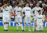 Real Madrid's players, pictured after the penalty shoot-out during their Champions League 2nd leg semi-final against Bayern Munich, at the Santiago Bernabeu in Madrid, on April 25. Spanish hopes of a mouth watering final between Real and Barcelona evaporated with both sides crashing out but at least Real have the consolation of being on the verge of claiming their first la liga title since 2008.