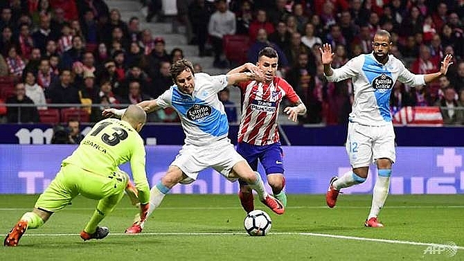 gameiro penalty edges atletico past deportivo