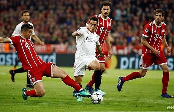 Bayern toil but overcome Sevilla to reach semi-finals