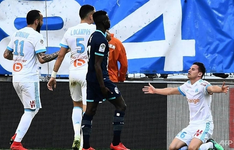 Marseille route Lille, Monaco toppled by Guingamp