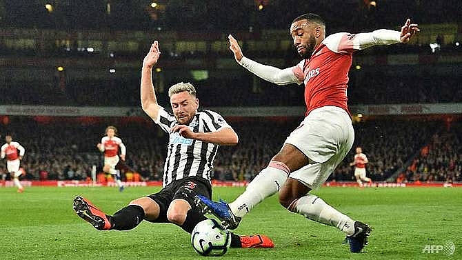 arsenal move up to third as ramsey lacazette sink newcastle
