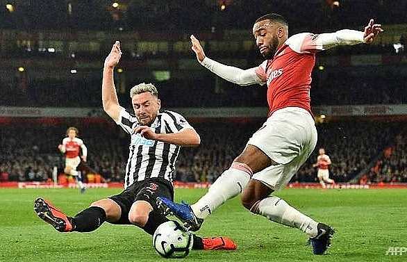 Arsenal move up to third as Ramsey, Lacazette sink Newcastle