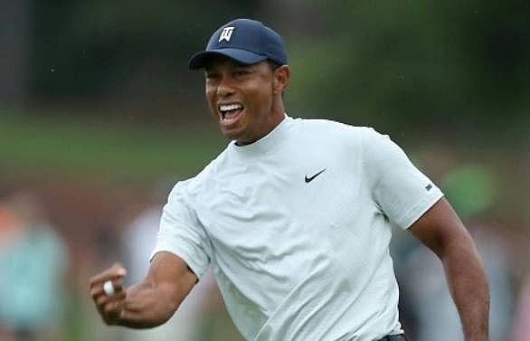 Woods shines brightest on star-studded Masters leaderbaord