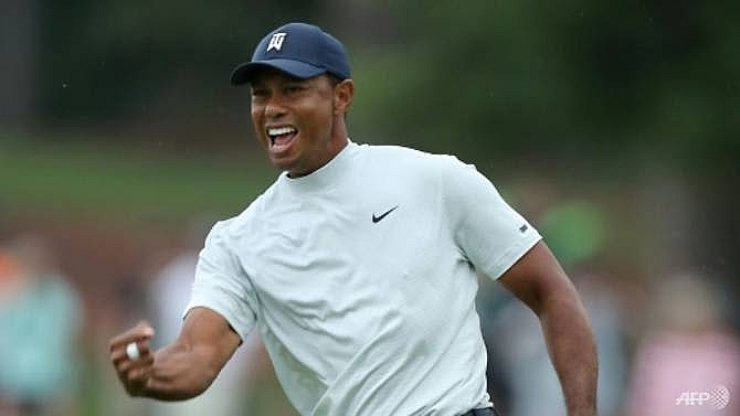 woods shines brightest on star studded masters leaderbaord