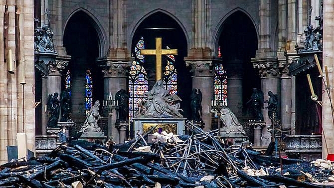 macron vows to rebuild a more beautiful notre dame in five years