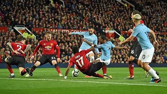 man city pile on misery for man utd to go back top