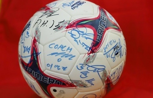 ball with signatures of vietnamese male players presented to japanese pm