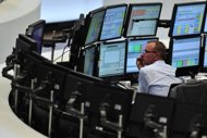 A trader at work at the German DAX index in Frankfurt. European stocks rebounded Thursday as Greece made another attempt to form a pro-bailout government while Spanish shares soared after Madrid stepped in to support the banking sector by nationalising a top lender.