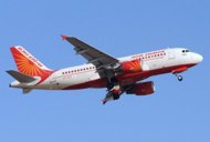 An Air India domestic flight takes off from Sardar Vallabhbhai Airport in Ahmedabad on Saturday. A union said Saturday it was ready for unconditional talks to end a five-day walkout by pilots of national carrier Air India, as the airline fired 25 more strikers and cancelled more flights
