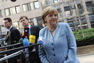 German Chancellor Angela Merkel arrives for a meeting of European Union leaders in Brussels. France and Germany headed into the summit facing confrontation over how to spur growth in the debt-stricken eurozone, as markets plunged and the euro hit a near two-year low. (AFP Photo/John Thys)