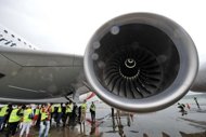 A Qantas Airbus A380 sits on the tarmac following repairs in April. Airbus has delayed repairs to wing cracks on its flagship A380 superjumbo to early next year in order to allow time to ensure the fixes are final, the company said. (AFP Photo/Roslan Rahman)