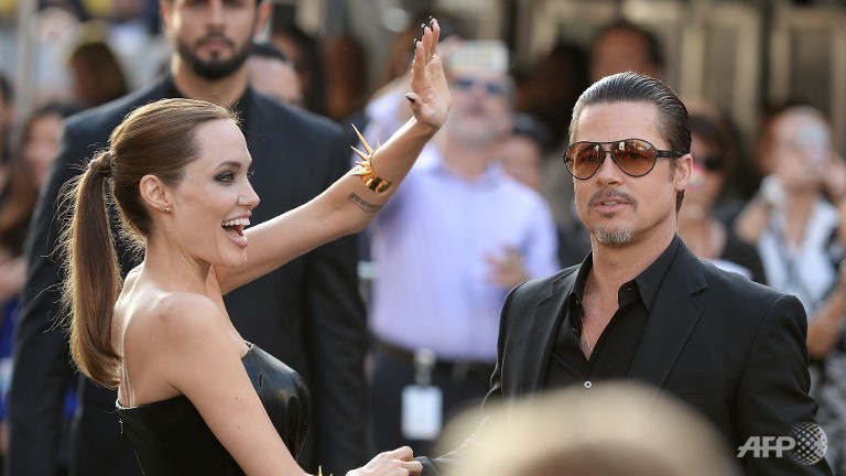 brad pitt punched in face at movie premiere