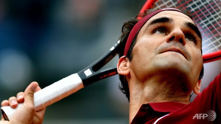 federer tests back injury with rome win over zverev