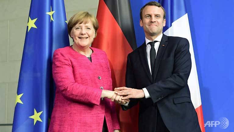 Macron, Merkel vow new momentum for Europe | World news ...