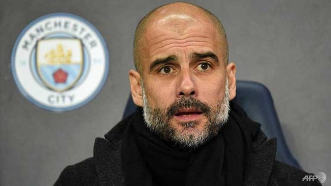 guardiola signs new contract to remain at man city until 2021