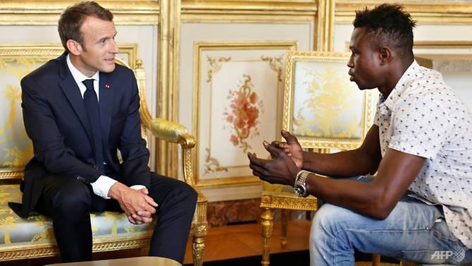 migrant spiderman who saved child praised by frances macron