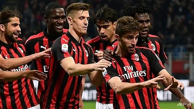 ac milan back in champions league race after bologna win