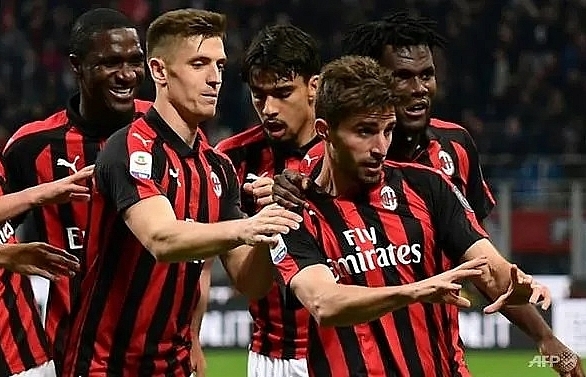 AC Milan back in Champions League race after Bologna win