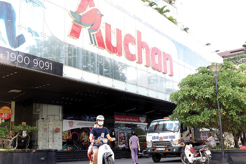 auchan throws in towel over tough competition