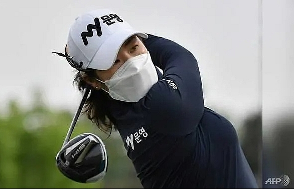 Facemasks, silence and social distancing as pro golf resumes in South Korea