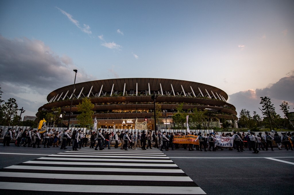 olympic chiefs japan visit postponed over virus