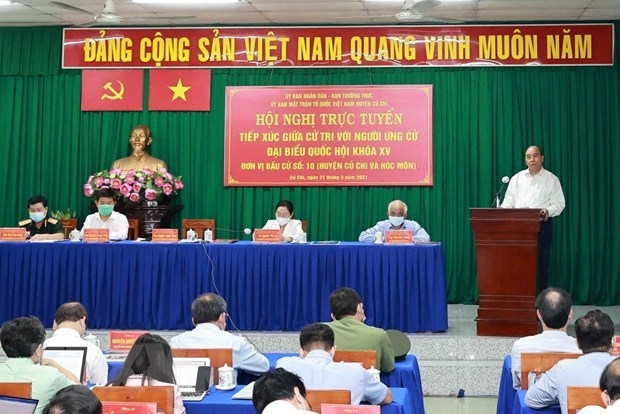 state president meets voters in hcm citys cu chi and hoc mon districts