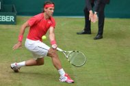 Spain's Rafael Nadal returns the ball during his second round match against Slovakia's Lukas Lacko at the ATP Gerry Weber Open tennis tournament in Halle, western Germany. Nadal won 7-5, 6-1. 