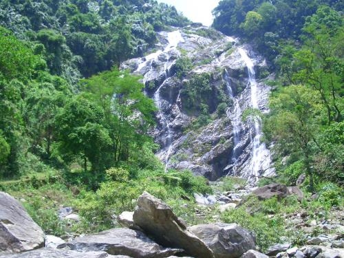 white waterfall longhair fairy awaits tourists footprints