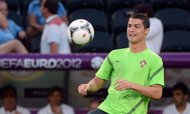 Portuguese forward Cristiano Ronaldo controls the ball during a training session at Donbass Arena in Donetsk. Portugal will face Spain for the Euro 2012 football championships semi-final on June 27 in Donetsk. (AFP Photo/Anne-Christine Poujoulat)