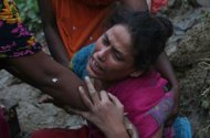 A Bangladeshi relative of landslide victims mourns in Chittagong. More than 55 people have been killed in landslides in southeast Bangladesh after three days of rains that triggered flash floods and severed transport links