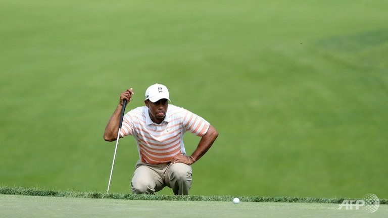 putting woes leave woods well back at memorial