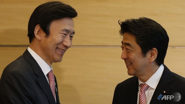 abe pledges to improve ties with south korea