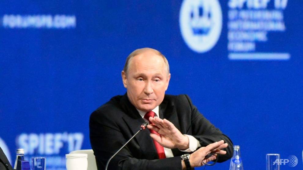 putin urges end to harmful chatter over russian meddling