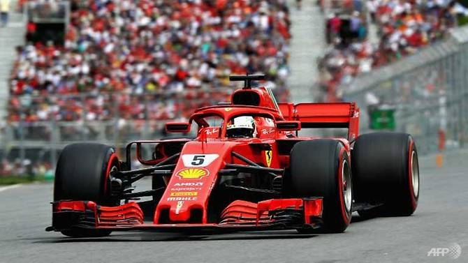 vettel claims 50th win and goes top in title race
