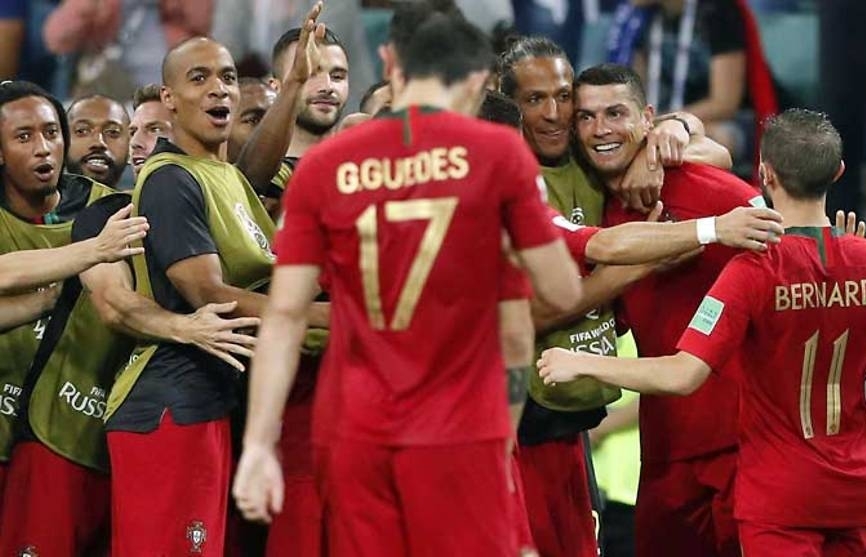 world cup ronaldo hits hat trick as portugal deny spain