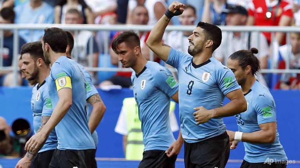 world cup uruguay punish sluggish russia to top group a