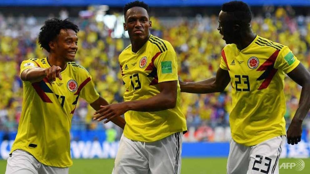 world cup mina winner sends colombia through as senegal go out