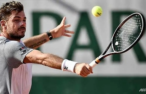 Wawrinka sets up Federer clash in Tsitsipas thriller, Nadal through