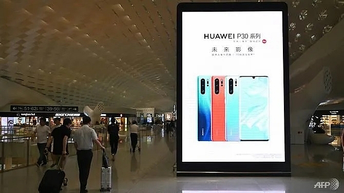 huawei denies being bound by chinese spy laws