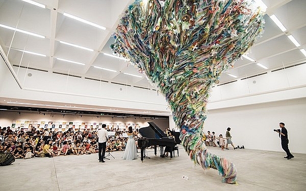 artworks made from used plastic warn of environmental damage