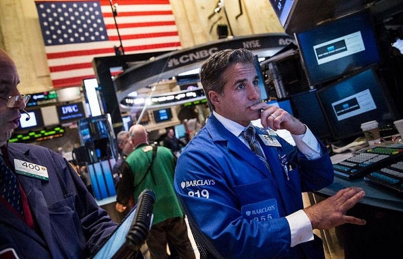 Nasdaq closes at new record high but S&P, Dow lower