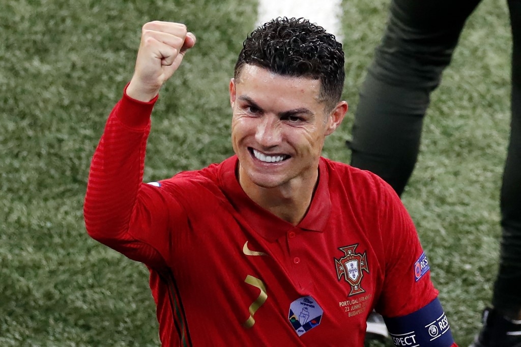 Portugal's forward Cristiano Ronaldo gestures towards the stands after the UEFA EURO 2020 Group F football match between Portugal and France at Puskas Arena in Budapest on June 23, 2021. Laszlo Balogh / POOL / AFP