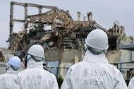 Members of a Japanese government panel investigate the accident at Fukushima nuclear power plant in June 2011. The nuclear accident at Fukushima last year was a 