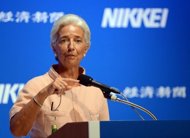 International Monetary Fund (IMF) chief Christine Lagarde delivers a speech at the Nikkei Special Forum at a hotel in Tokyo. Lagarde has warned that the global economy was slowing, with a soon-to-be published growth outlook lower than earlier forecasts