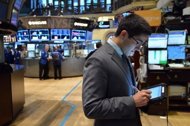 A trader works on the floor of the New York Stock Exchange in June 2012. US stocks broke a six-day losing streak Friday, helped by better-than-feared JPMorgan Chase results that bared a $5.8 billion loss on its bungled London derivatives trading operation. (AFP Photo/Stan Honda)