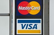 Credit card giants Visa and MasterCard agreed Friday to pay more than $6 billion to millions of merchants which had sued them for allegedly fixing card-use fees. (AFP Photo/Nicholas Kamm)