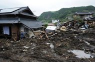 Flood-battered Japan warily eyes typhoon