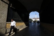 A man passes through a tunnel near Rossio Square in downtown Lisbon in 2011. Portugal can still reach its 2012 budget targets but the risk of failure has grown significantly, officials from the European Commission and International Monetary Fund said on Tuesday. (AFP Photo/Patricia de Melo Moreira)